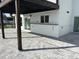 Charming patio area with stone pavers, outdoor bar, and covered seating perfect for entertaining at 4104 Pine Dale Ct, Hernando Beach, FL 34607