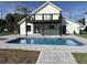 Beautiful backyard featuring a private in-ground pool, patio area, and a covered deck perfect for outdoor enjoyment at 4104 Pine Dale Ct, Hernando Beach, FL 34607