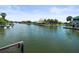 Scenic waterfront view showcasing canal homes with private docks, emphasizing the tranquility of waterfront properties at 4104 Pine Dale Ct, Hernando Beach, FL 34607