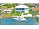 A waterfront property features direct gulf access, a private dock, and a spacious backyard for outdoor activities at 4469 Bahama Dr, Hernando Beach, FL 34607