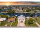 Stunning aerial view of waterfront homes, docks and boat lifts on canals at sunset in Hernando Beach at 4469 Bahama Dr, Hernando Beach, FL 34607