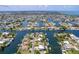 Expansive aerial view of the waterfront community, showcasing numerous canals and waterfront homes in Hernando Beach, Florida at 4469 Bahama Dr, Hernando Beach, FL 34607