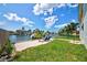 Canal-front backyard with seating, a well-maintained lawn, and beautiful water views at 4469 Bahama Dr, Hernando Beach, FL 34607