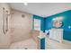 Bright bathroom with blue walls featuring a tiled walk-in shower and vanity with white cabinets at 4469 Bahama Dr, Hernando Beach, FL 34607