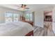 Comfortable bedroom with water views from the windows and a private access sliding door at 4469 Bahama Dr, Hernando Beach, FL 34607