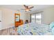 Bedroom with light wood floors and a sliding door to a balcony overlooking the outside view at 4469 Bahama Dr, Hernando Beach, FL 34607