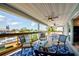 Enjoy a waterfront view from the covered deck, complete with ceiling fans and comfortable seating for outdoor relaxation at 4469 Bahama Dr, Hernando Beach, FL 34607