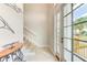 Bright entryway with tiled floors, stairs to the upper level, and a decorative table with views to the outside at 4469 Bahama Dr, Hernando Beach, FL 34607