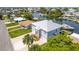 Exterior view featuring the home's architectural details, landscaping, and convenient access to waterfront activities at 4469 Bahama Dr, Hernando Beach, FL 34607