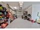 Garage with gray epoxy floors and white walls is spacious and provides ample room for storage at 4469 Bahama Dr, Hernando Beach, FL 34607