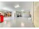 Spacious garage with epoxy flooring, shelving, tool storage, and ample room for vehicles at 4469 Bahama Dr, Hernando Beach, FL 34607