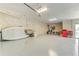 Oversized garage with epoxy flooring, high ceilings, and plenty of open space for storage at 4469 Bahama Dr, Hernando Beach, FL 34607