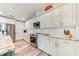 Bright, spacious kitchen featuring white cabinets, stainless steel appliances, and beautiful countertops at 4469 Bahama Dr, Hernando Beach, FL 34607
