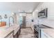 Bright and airy kitchen with white cabinetry, granite countertops, and stainless steel appliances at 4469 Bahama Dr, Hernando Beach, FL 34607