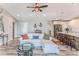 Open-concept living area with stylish decor, a cozy sofa, and seamless flow to the kitchen at 4469 Bahama Dr, Hernando Beach, FL 34607