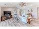 Open concept living room with comfortable seating, contemporary decor and great ceiling fan at 4469 Bahama Dr, Hernando Beach, FL 34607