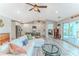 Spacious open-concept living area featuring a kitchen island and view of the water beyond the screened in patio at 4469 Bahama Dr, Hernando Beach, FL 34607
