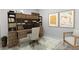 Home office with custom wood desk, shelving, and comfortable seating for productive work at 4469 Bahama Dr, Hernando Beach, FL 34607