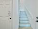 Staircase leading up, next to a door with an elevator shaft sign; 'Caution 12 inch step down' is posted at 4469 Bahama Dr, Hernando Beach, FL 34607
