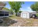 Spacious backyard with storage shed and partial fence, offering privacy and ample space at 4537 Cynthia Ln, Spring Hill, FL 34606