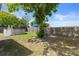 Fenced backyard with above-ground pool, mature tree, and plenty of space for outdoor activities at 4537 Cynthia Ln, Spring Hill, FL 34606