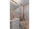 Bathroom features a tiled shower, sink, and nautical decor at 4537 Cynthia Ln, Spring Hill, FL 34606