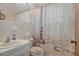 Nautical themed bathroom with shower, sink, and vanity at 4537 Cynthia Ln, Spring Hill, FL 34606