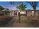 Charming single-story home with a brick facade, mature trees, and a well-maintained front yard and covered carport at 4537 Cynthia Ln, Spring Hill, FL 34606