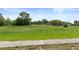 Image of a grassy field, with several houses in the distance at 4537 Cynthia Ln, Spring Hill, FL 34606