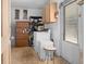 Laundry area with washer, dryer, and storage cabinets, providing convenience and organization at 4537 Cynthia Ln, Spring Hill, FL 34606
