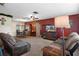 Comfortable living room open to dining area with plush seating, ceiling fan, and natural light at 4537 Cynthia Ln, Spring Hill, FL 34606