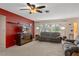 Living room featuring neutral carpet, comfortable sofa, and a ceiling fan, and natural light at 4537 Cynthia Ln, Spring Hill, FL 34606