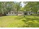 The back exterior of the property, including the windows and sliding glass doors to the backyard at 507 Jewel St, Brooksville, FL 34601