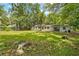An exterior view of the backyard, which has the property's home in the background at 507 Jewel St, Brooksville, FL 34601