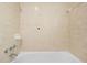 Bathroom with white tile and a standard bathtub and shower at 507 Jewel St, Brooksville, FL 34601