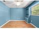 Bright bedroom with wood flooring, a ceiling fan, and built in shelving at 507 Jewel St, Brooksville, FL 34601