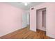 This cozy bedroom has a walk-in closet and hardwood floors at 507 Jewel St, Brooksville, FL 34601