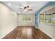 Bright bedroom with hardwood floors, natural light from two windows, and recessed lighting at 507 Jewel St, Brooksville, FL 34601