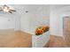 Living room with hardwood floors, a decorative brick wall partition, and a ceiling fan at 507 Jewel St, Brooksville, FL 34601