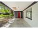 Covered patio with white ceiling and dark trim. Concrete flooring at 507 Jewel St, Brooksville, FL 34601