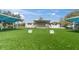 Outdoor amphitheater with a big stage and lots of grassy seating area in the sunshine at 5440 Manatee Point Drive, New Port Richey, FL 34652