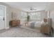 Bright bedroom featuring neutral tones, multiple windows, and soft carpet at 5440 Manatee Point Drive, New Port Richey, FL 34652