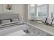 Bedroom featuring a window seat, neutral decor, and a plush bed at 5440 Manatee Point Drive, New Port Richey, FL 34652