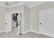 Light and airy interior with views of a spiral staircase through an open doorway at 5440 Manatee Point Drive, New Port Richey, FL 34652