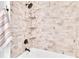 Shower featuring neutral tile, a shower head, tub, and built in shelves at 5440 Manatee Point Drive, New Port Richey, FL 34652