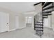 Unique spiral staircase leading to upper level, complemented by neutral-colored walls and ample natural light at 5440 Manatee Point Drive, New Port Richey, FL 34652