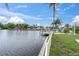 Expansive canal view from the property, showcasing waterfront living and boat docks nearby at 5440 Manatee Point Drive, New Port Richey, FL 34652