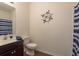 Well-lit bathroom featuring a nautical theme and neutral-toned walls at 5520 White Marlin Ct, New Port Richey, FL 34652