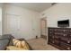 Bedroom with a cozy sofa, stylish dresser, and ample natural light at 5520 White Marlin Ct, New Port Richey, FL 34652