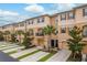 Inviting townhome exterior with neat landscaping and private garages at 5520 White Marlin Ct, New Port Richey, FL 34652